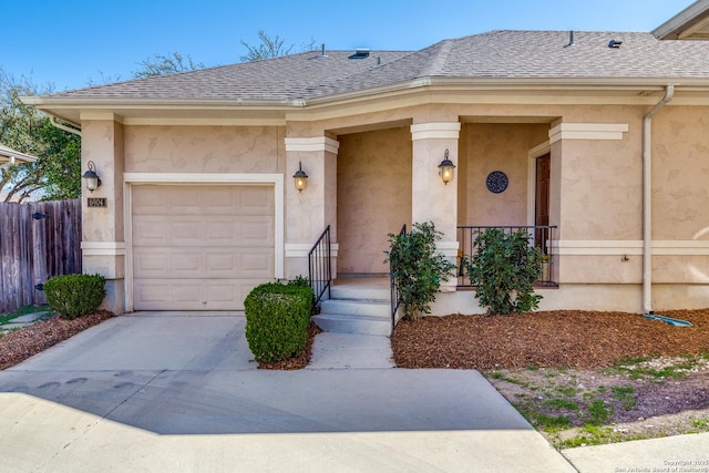 view of front of home with a shingled roof, fence, a porch, stucco siding, and a garage