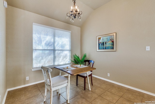 dining room featuring lofted ceiling, a notable chandelier, light tile patterned flooring, and baseboards