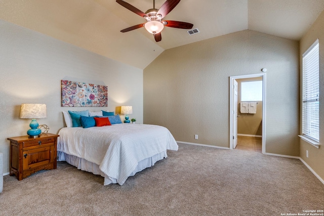 bedroom featuring visible vents, lofted ceiling, multiple windows, and light carpet