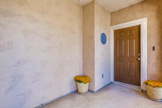 view of exterior entry with stucco siding