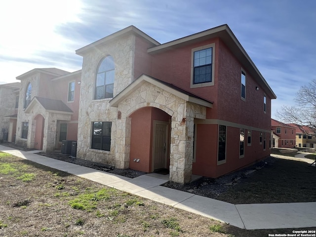 view of front of home with cooling unit