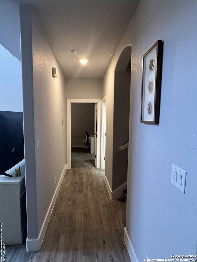 hall featuring dark wood-type flooring