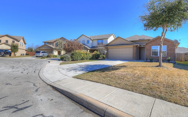 view of front facade with a garage and a front yard