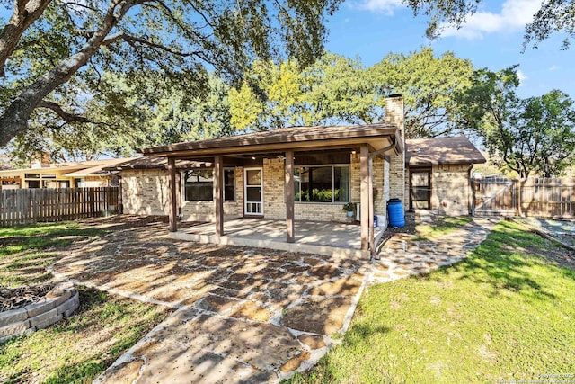 back of house featuring a patio