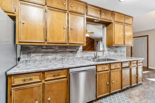 kitchen featuring tasteful backsplash, ceiling fan, sink, and appliances with stainless steel finishes