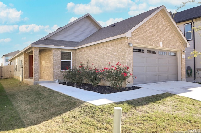 view of front of home featuring a garage and a front lawn