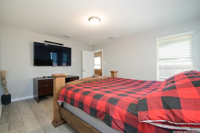 bedroom with light hardwood / wood-style floors