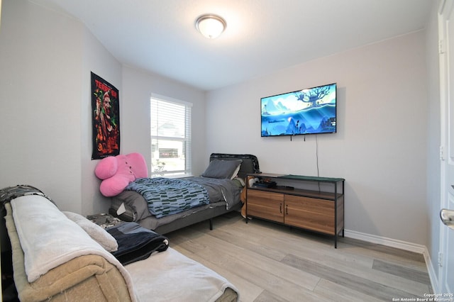 bedroom with light wood-type flooring