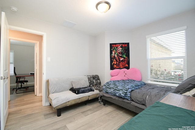 bedroom with light wood-type flooring