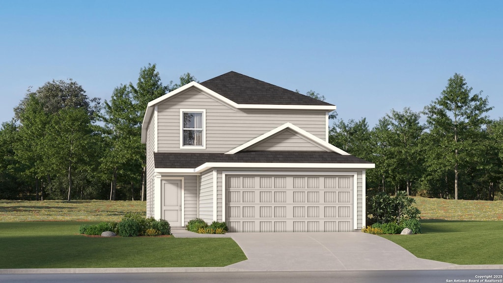 view of front of property featuring a front yard and a garage