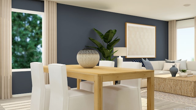 dining space with wood-type flooring