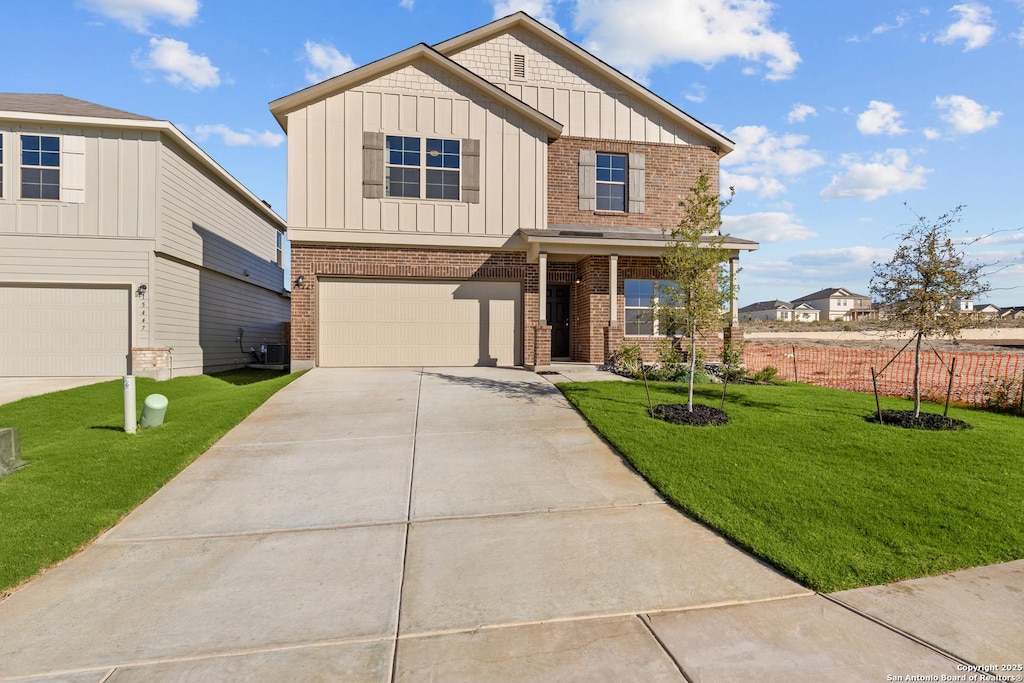 craftsman inspired home with central AC, a garage, and a front lawn