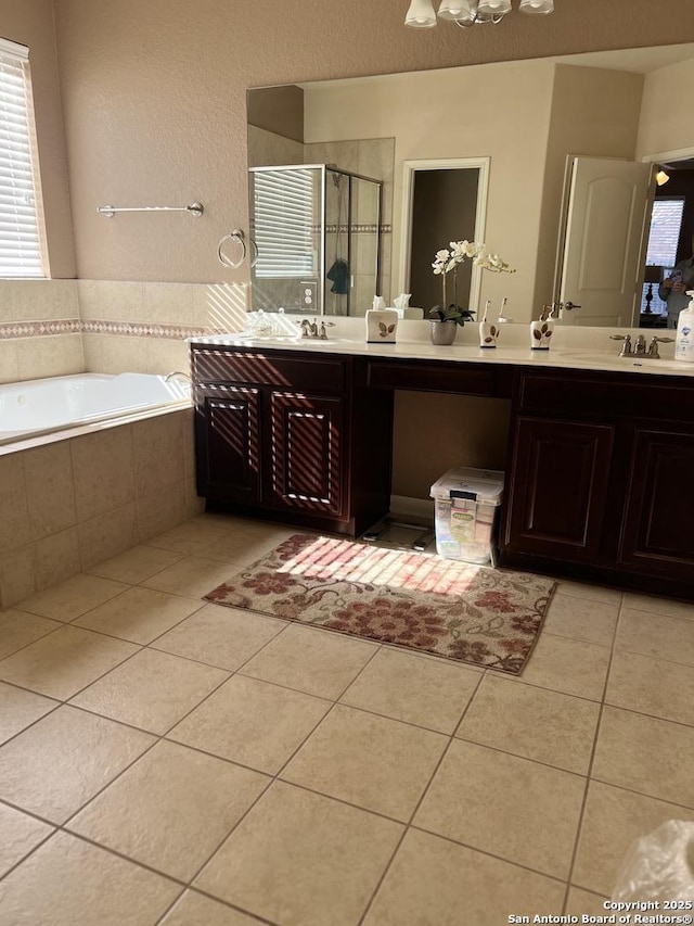 bathroom featuring vanity, tile patterned floors, and plus walk in shower