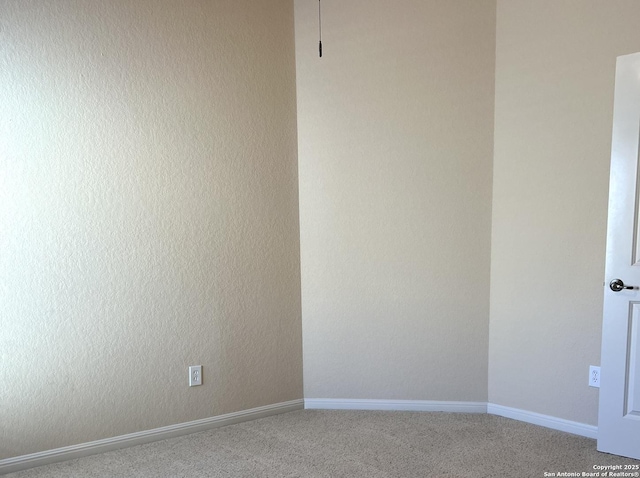 unfurnished room with carpet floors