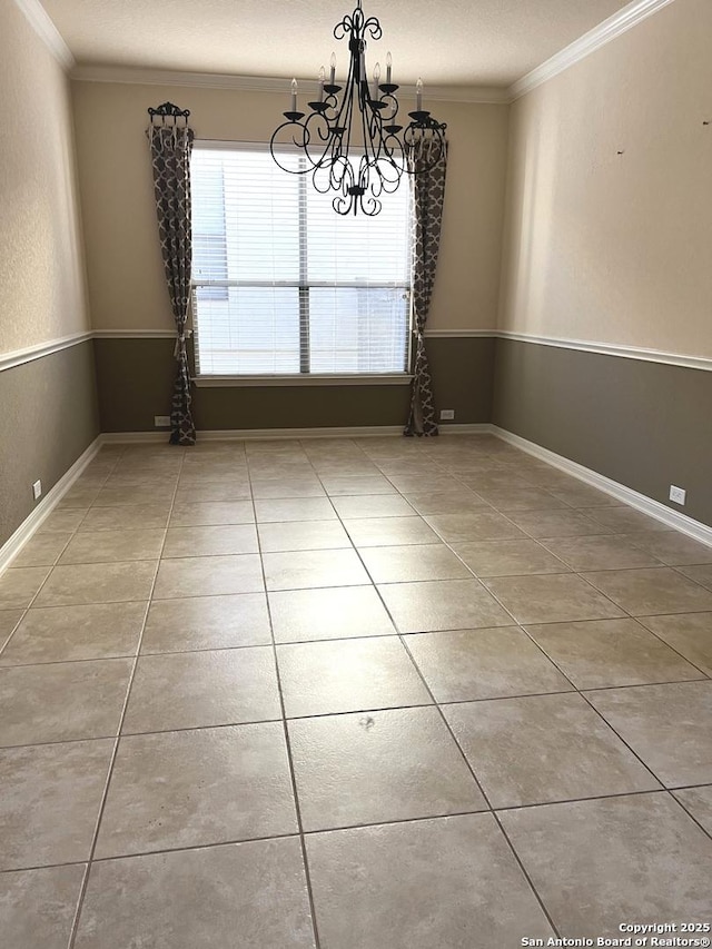 unfurnished dining area with a textured ceiling, crown molding, a chandelier, and light tile patterned flooring