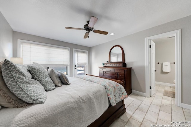 bedroom featuring access to outside, ceiling fan, and ensuite bathroom