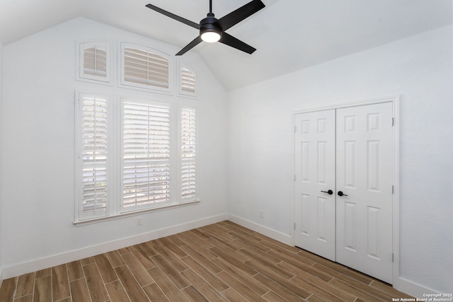 spare room featuring ceiling fan and vaulted ceiling