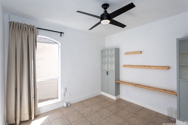 unfurnished room with ceiling fan