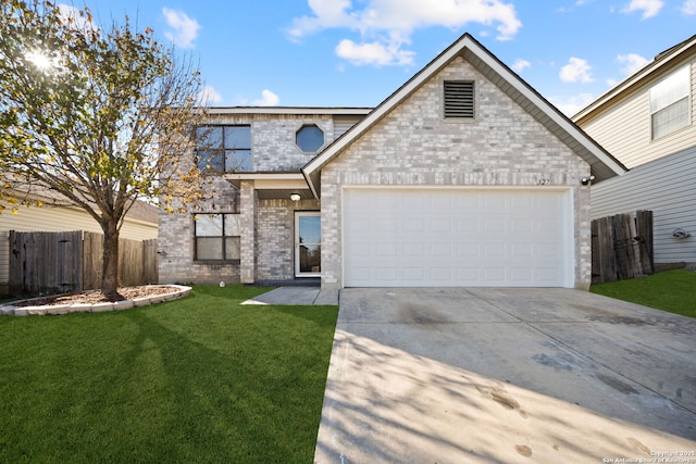 view of front of property with a front yard and a garage