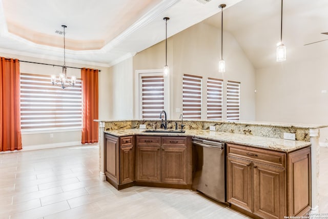 kitchen featuring light stone countertops, a tray ceiling, sink, decorative light fixtures, and dishwasher