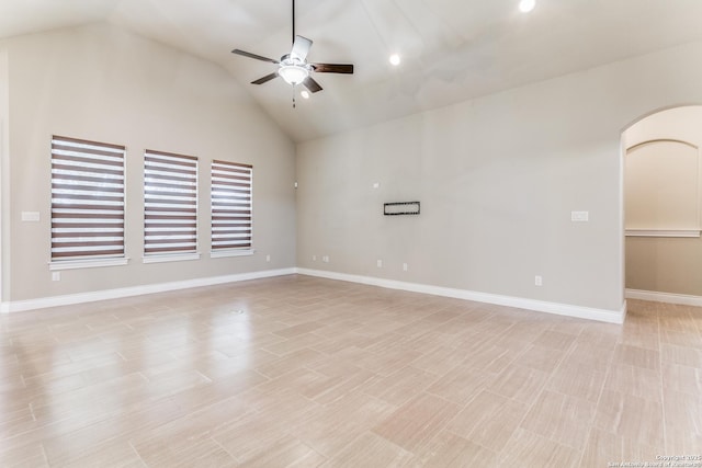 unfurnished room featuring ceiling fan and vaulted ceiling