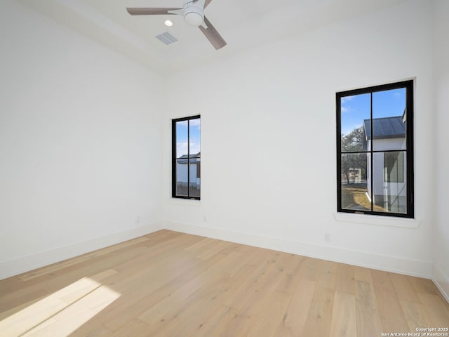 unfurnished room featuring ceiling fan and light wood-type flooring