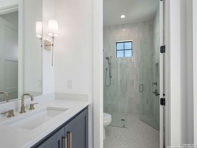 bathroom with tile patterned flooring, vanity, toilet, and a shower with shower door