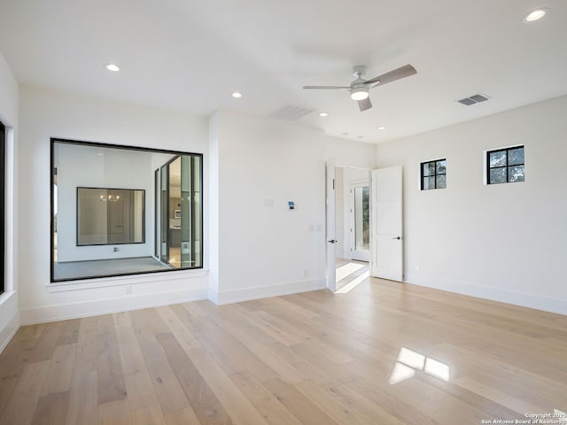 unfurnished room featuring ceiling fan and light wood-type flooring