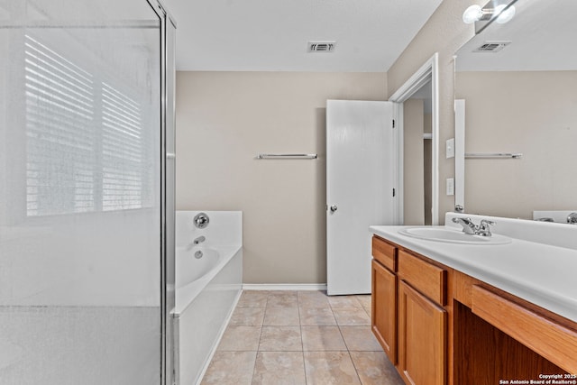 bathroom with tile patterned flooring, vanity, and independent shower and bath