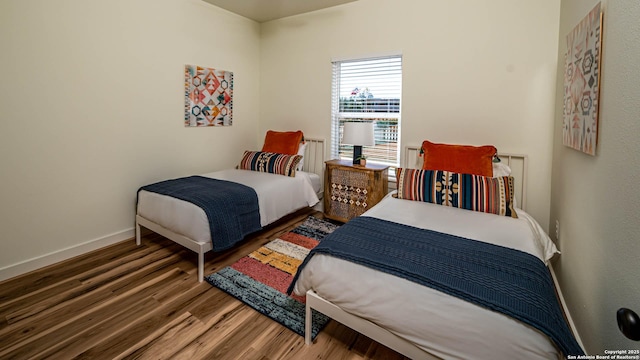 bedroom featuring dark hardwood / wood-style flooring