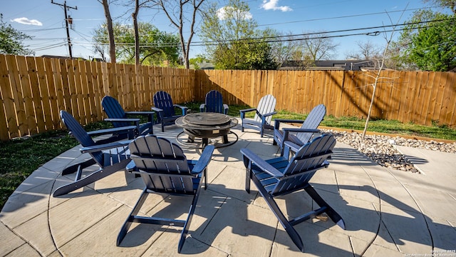 view of patio featuring a fire pit