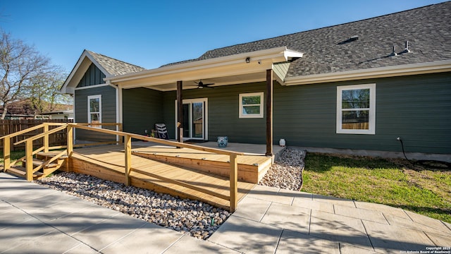 rear view of house with ceiling fan and a patio area