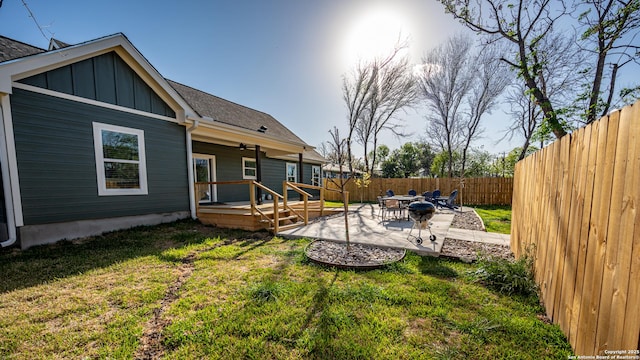 view of yard featuring a patio and a deck