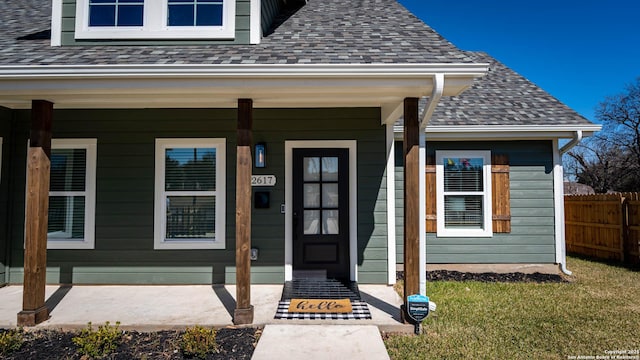 view of exterior entry with covered porch