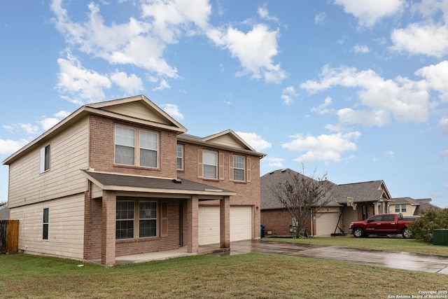 view of front of property with a garage and a front lawn