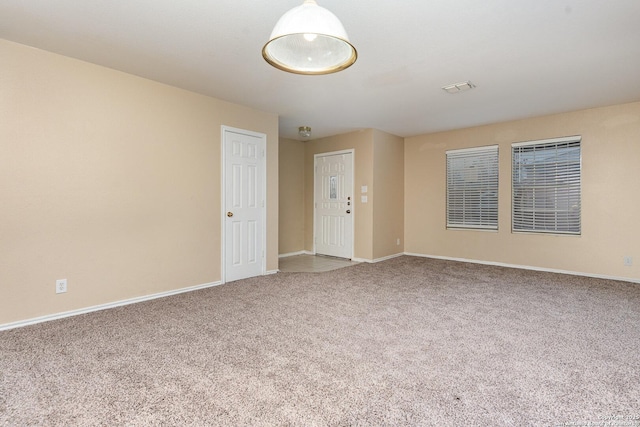 spare room featuring carpet flooring