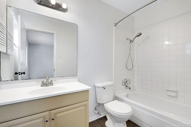 full bathroom featuring vanity, toilet, and tiled shower / bath