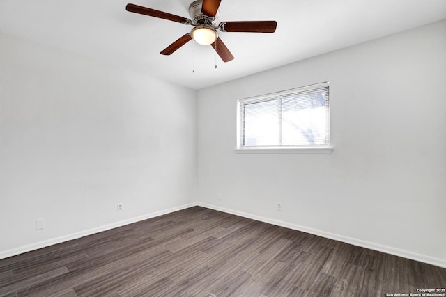 unfurnished room featuring dark hardwood / wood-style floors and ceiling fan