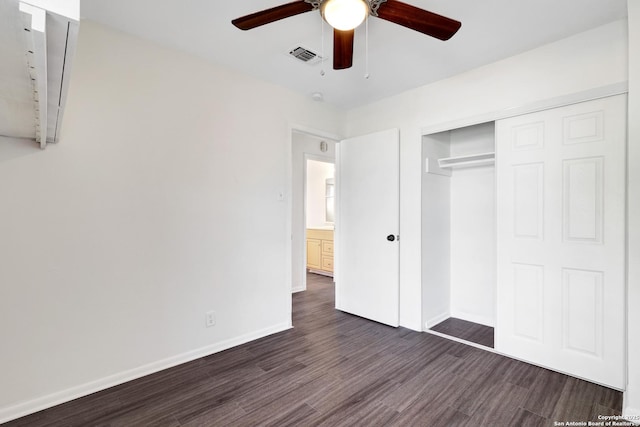 unfurnished bedroom with a closet, ceiling fan, and dark hardwood / wood-style floors