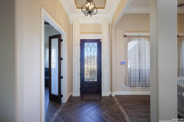 entrance foyer with crown molding, dark parquet floors, and an inviting chandelier