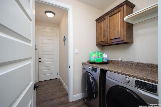 laundry area with cabinets, dark hardwood / wood-style floors, and independent washer and dryer