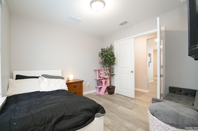 bedroom with light hardwood / wood-style flooring