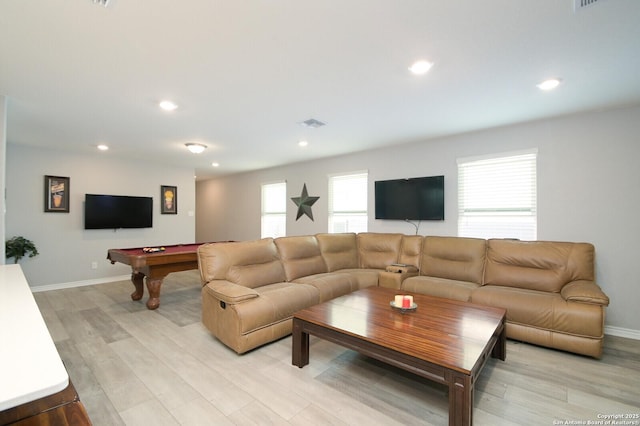 living room with plenty of natural light, light wood-type flooring, and billiards