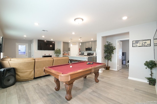 game room with light hardwood / wood-style floors and billiards