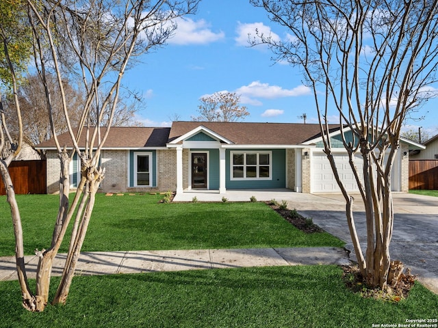 ranch-style home with a front yard and a garage