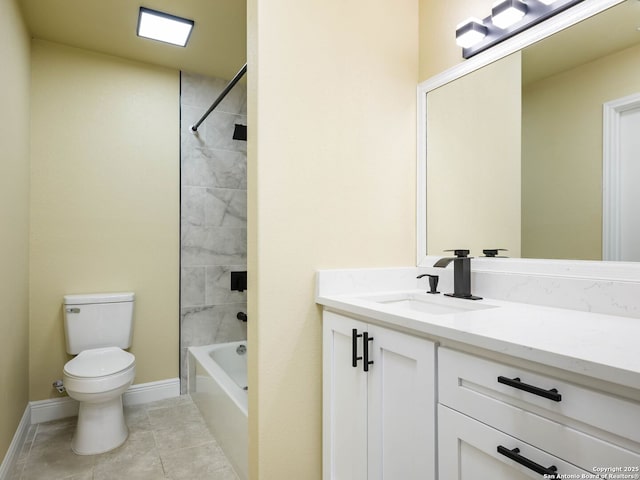 full bathroom with tile patterned flooring, vanity, tiled shower / bath combo, and toilet