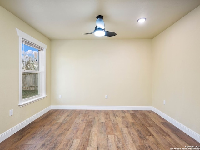 spare room with hardwood / wood-style flooring