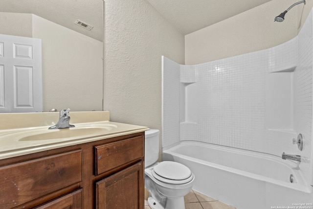 full bathroom with tub / shower combination, a textured ceiling, vanity, tile patterned flooring, and toilet