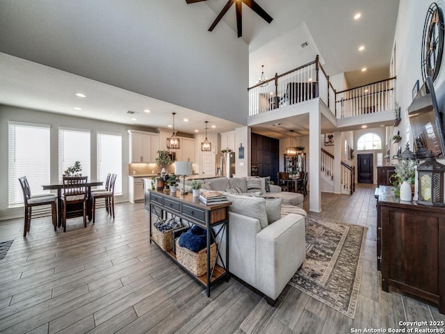 living room with a high ceiling and a chandelier