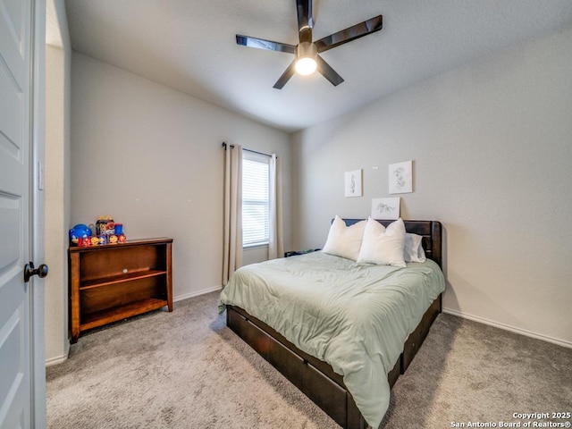 carpeted bedroom with ceiling fan